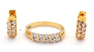 An 18ct diamond ring and matching earrings, the ring set with round brilliant cut diamonds, total