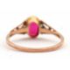 A synthetic ruby ring, the oval synthetic ruby with tapered shoulders and plain band stamped 9ct, - Image 4 of 8