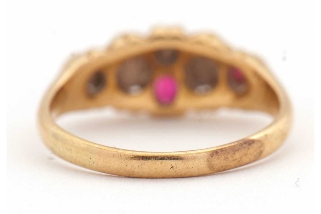 An opal and ruby ring, wtih two round opal cabochons and small round faceted rubies, with tapered - Image 4 of 6