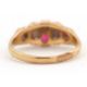 An opal and ruby ring, wtih two round opal cabochons and small round faceted rubies, with tapered - Image 4 of 6