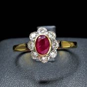 AN 18CT GOLD RUBY AND DIAMOND RING.