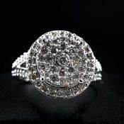 A DIAMOND CLUSTER DRESS RING.