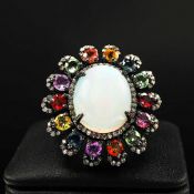AN OPAL, SAPPHIRE AND DIAMOND CLUSTER RING.