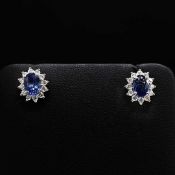 PAIR OF 18CT WHITE GOLD SAPPHIRE AND DIAMOND CLUSTER STUDS.