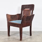 AN ANGLO-INDIAN TEAK ARMCHAIR.