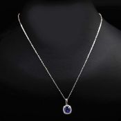 AN 18CT WHITE GOLD SAPPHIRE AND DIAMOND PENDANT NECKLACE.