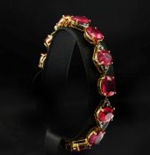 A LARGE SILVER-GILT RUBY AND DIAMOND BRACELET.