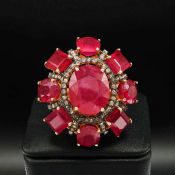 A LARGE RUBY AND DIAMOND COCKTAIL RING.