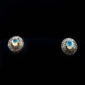 A PAIR OF OPAL AND DIAMOND STUD EARRINGS.