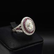 A PLATINUM DIAMOND AND RUBY DRESS RING.