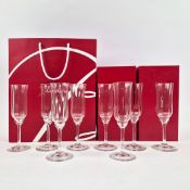 A BACCARAT 'CAPRI' SET OF EIGHT CHAMPAGNE FLUTES.