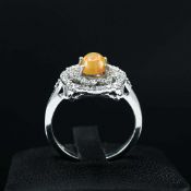 AN OPAL AND DIAMOND CLUSTER DRESS RING.