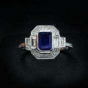 AN ART DECO STYLE PLATINUM SAPPHIRE AND DIAMOND RING.