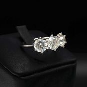 A PLATINUM DIAMOND TRILOGY RING.