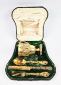 A FOUR PIECE VICTORIAN SILVER-GILT CHRISTENING SET.