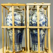 PAIR OF LARGE CHINESE BLUE AND WHITE CERAMIC LIDDED TEMPLE JARS.