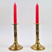 A PAIR OF 18TH/19TH CENTURY BRASS EJECTOR CANDLESTICKS (2).