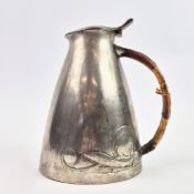 AN ARCHIBALD KNOX FOR LIBERTY AND CO WATER JUG.