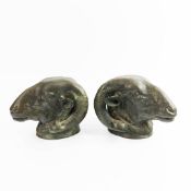 BRONZE RAMS HEADS, A PAIR. (2).