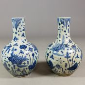PAIR OF CHINESE BLUE AND WHITE CERAMIC BOTTLE NECK VASES.