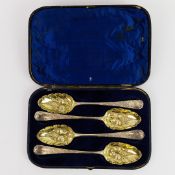 A BOXED SET OF FOUR GEORGIAN SILVER BERRY SPOONS.