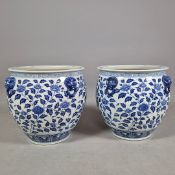 PAIR OF BLUE AND WHITE CERAMIC PLANTERS.