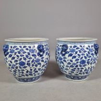 PAIR OF BLUE AND WHITE CERAMIC PLANTERS.