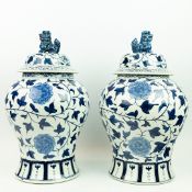 CHINESE EXPORT STYLE BLUE AND WHITER CERAMIC TEMPLE JARS, A PAIR.