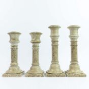 STONE CANDLE STICKS, TWO PAIRS.