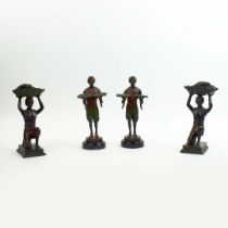 FRANZ BERGMANN. In the manner of. A PAIR OF CANDLESTICKS AND A PAIR OF BLACKAMORE DUMB WAITERS. (4).