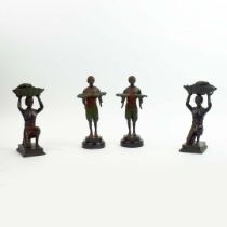 FRANZ BERGMANN. In the manner of. A PAIR OF CANDLESTICKS AND A PAIR OF BLACKAMORE DUMB WAITERS. (4).