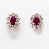 A PAIR OF 9CT GOLD RUBY AND DIAMOND STUD EARRINGS.