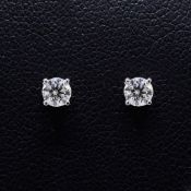 A PAIR OF 18CT GOLD DIAMOND STUD EARRINGS.