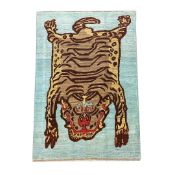 FINE TIBETAN TIGER CARPET.