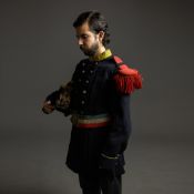 A COLLECTION OF MILITARY UNIFORMS.