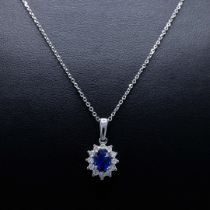 AN 18CT WHITE GOLD SAPPHIRE AND DIAMOND PENDANT NECKLACE.