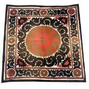 AN ANTIQUE UZBEK SUZANI WALL HANGING.