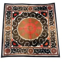 AN ANTIQUE UZBEK SUZANI WALL HANGING.