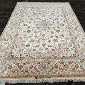 FINE SILK AND WOOL TABRIZ CARPET.