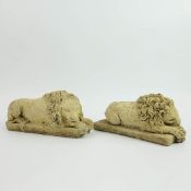 SCULPTURAL RECUMBENT LIONS, A PAIR.