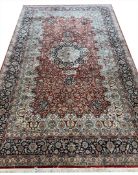 FINE PURE SILK HEREKE DESIGN RUG.