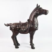 A BRONZE OVERLAID FIGURE OF A HORSE.