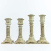 STONE CANDLE STICKS, TWO PAIRS.