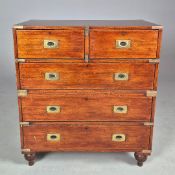 A MAHOGANY CAMPAIGN CHEST OF DRAWERS.