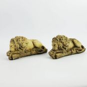 SCULPTURAL RECUMBENT LIONS, A PAIR.
