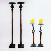 SET OF FOUR 1970s ITALIAN BAMBOO AND CAST METAL CANDLESTICKS.