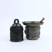 A MINITURE CHINESE BRONZE TEMPLE BELL AND A PESTLE AND MORTAR. (3).