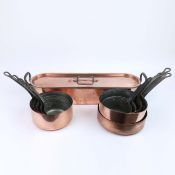 A BATTERIE DE CUISINE FIVE PANS AND A FISH POACHER. (11).