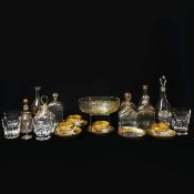 ST LOUIS. FIVE LARGE CUT WHISKEY GLASSES AND FOUR GILT TEA CUPS ALONG WITH VARIOUS GILT DECANTERS.