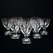 A SET OF EIGHT GEORGIAN LEMON-SQUEEZER FOOTED ENGRAVED RUMMERS. (8).